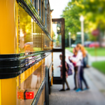 Children Getting On A School Bus